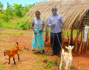 Change Her World couple with goats in Malawi